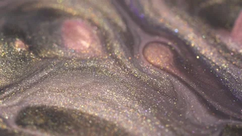 Holographic Glitter Makeup. Liquid glitter nail polish macro. Golden and pink Stock Footage 240887448