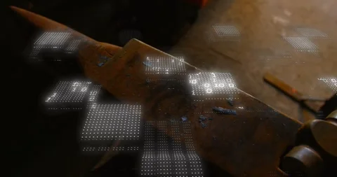 Holographic grid appearing over worn metal anvil, scanning surface and revealing Stock Footage 330546994