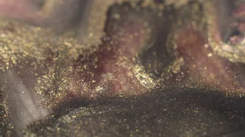 Holographic makeup cosmetics texture macro. Liquid Glitter gold and pink ink mix Stock Footage 224797129