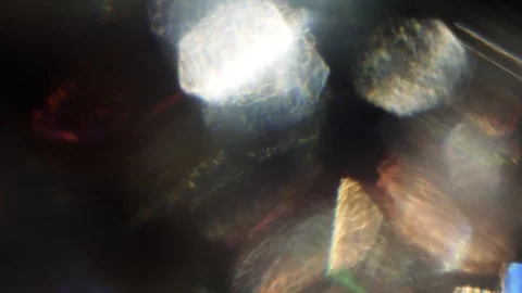 Holographic mix of abstract objects, bokeh floating in the dark. 库存影片 103049308