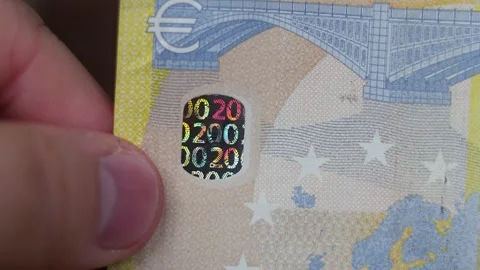 Holographic security element with number 200 on two hundred euro paper banknote Video stock 347470559