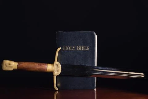The Holy Bible with Ancient Sword Stock Photos