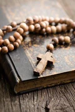 Holy bible and rosary beads Stock Photos