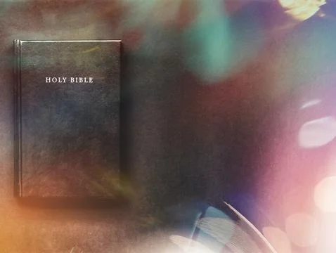 Holy Bible on the black background Stock Photos