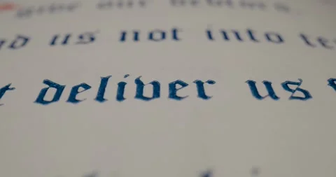 Holy Bible Macro Text Deliver Us From Evil Pan Right Stock Footage 299953381