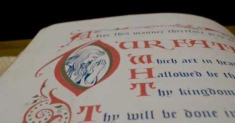Holy Bible Macro Text Our Father Which Art In Heaven Pan Right Vidéo 299954832