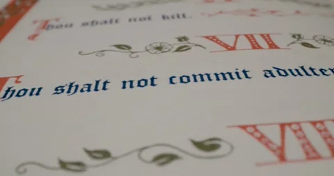 Holy Bible Macro Text Thou Shalt Not Commit Adultery Pan Right Stock Footage 299955084
