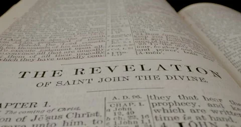 Holy Bible Macro Text Title Revelation Of Saint John The Divine Tilt Down Stock Footage 299956305