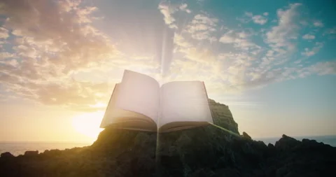 Holy Bible printed open sacred book against sunset sky natural background. Rocky Stock Footage 232899345
