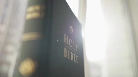 Holy bible in the rays of the sun. Stock Footage 303589148