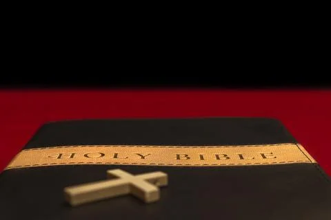 Holy bible on red table Stock Photos
