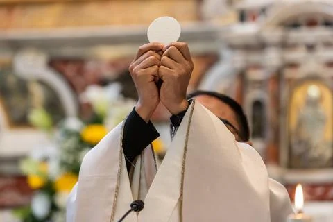 The Holy Bread in the rite of Eucharist Stock Photos