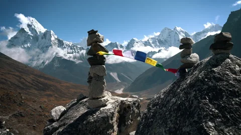 Holy Buddhist prayer flags with multicolored mantras flapping in strong wind, va Stock-Footage 315369898