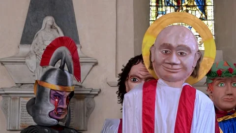 Holy Models and Giant Puppet Heads Inside St Albans Cathedral Stock Footage 345010450