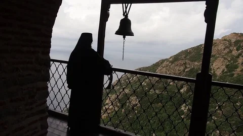 Holy Monastery Simonopetra, monk knocks on iron beater for Liturgy Video stock 73266922