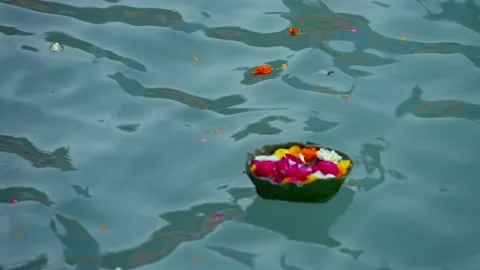 Holy offering of flowers with lamp river ganga haridwar Stock Footage 214322688