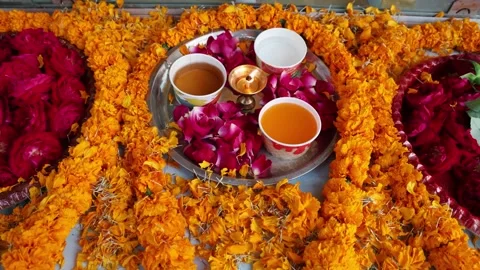 Holy offerings placed by devotee at monastery Stock Footage 313774908
