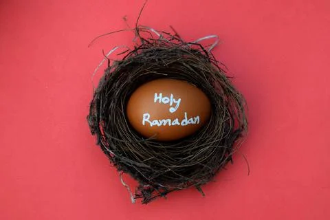 Holy Ramadan hand typography on the egg. Fotos Stock