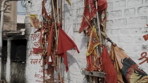 Holy red flags offered by devotee at temple at day Stock Footage 264028484