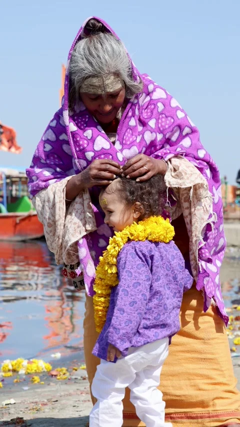 Holy Sadhvi Offering Loving Blessing to Little Krishna Devotee at Vrindavan Stock Footage 340814587