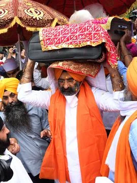 Holy scriptures of Sikhism return to India with evacuation flight, New Delhi - 2 Stock Photos