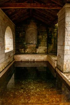 Holy spring in Lyadovsky rocky monastery, Ukraine Stock Photos