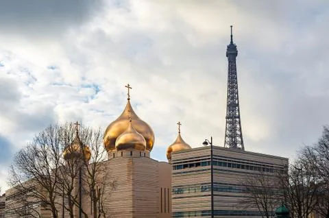 Holy Trinity cathedral and Eiffel tower in Paris 스톡 사진