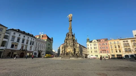 Holy Trinity Column on historic square in Olomouc, tourists and people walking Stock Footage 263483676