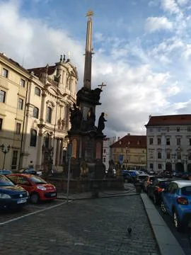 The Holy Trinity Column stands prominently in Malostranské náměstí Stock Photos