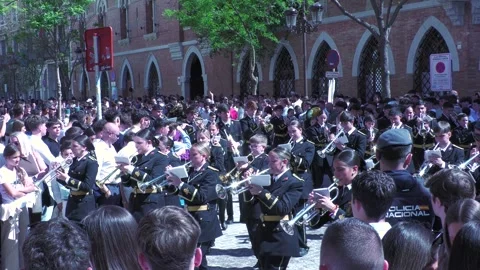 Holy Week Band Marching Through Crowded Street in Seville Stock Footage 336015196