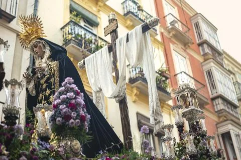 Holy Week procession in Malaga with the Virgin Mary and the cross, Spain Stock Photos
