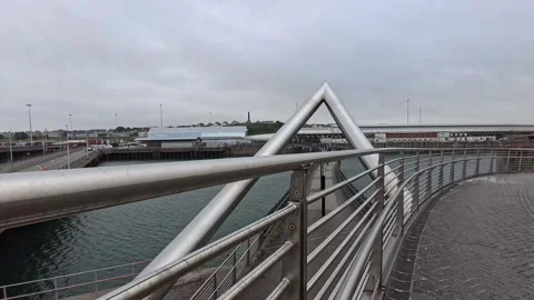 Holyhead Celtic gateway bridge crossing over from town to the ferry terminal Stock Footage 339092787
