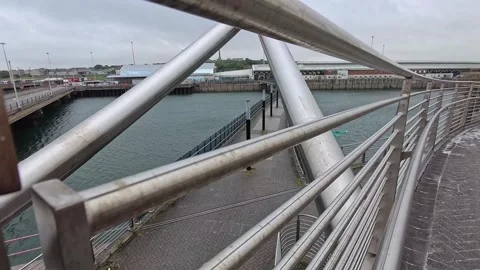 Holyhead Celtic gateway bridge railings leading from town to the ferry terminal Stock Footage 339093686