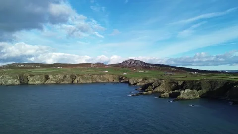 Holyhead mountain rugged welsh coastline aerial view establishing remote Stock Footage 321938136