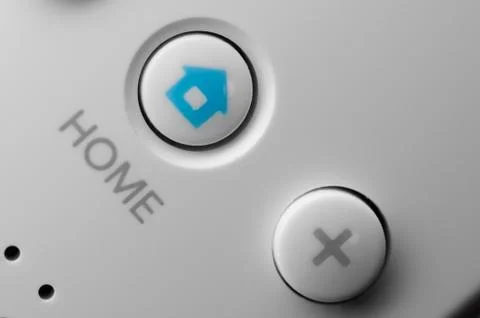 Home and plus buttons on a remote controller Stock Photos