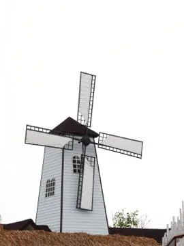 Home and windmill Stock Photos