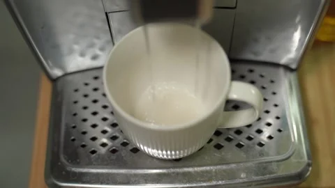 The home automatic coffee machine starts cleaning and decalcifying the system. Stock Footage 310049597