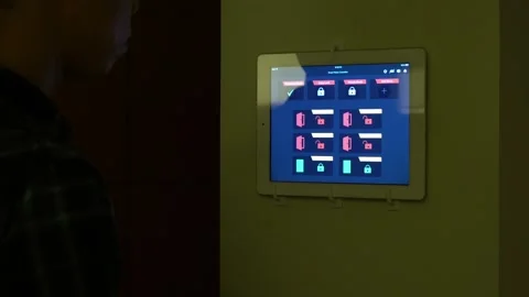 Home Automation. A tablet with Smarthome application showing various icons for Stock Footage 318914038