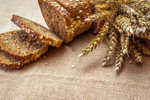 Home baked bread. Rye bakery with crusty loaves and crumbs. Fresh rustic trad Stock Photos