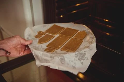 Home Baked Rectangular Cookies On Parchment Paper Ready To Bake In The Oven.. 库存照片