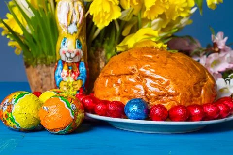 Home baked traditional Easter bread or Paska decorated for festive table, eegs Stock Photos