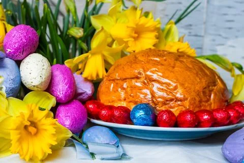 Home baked traditional Easter bread or Paska decorated for festive table, eegs Stock Photos