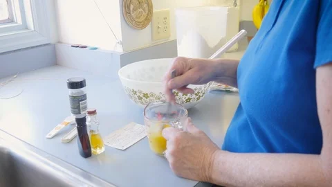 Home Baker Adds Eggs to a Sweet Dough in a Rustic Farmhouse Kitchen in 4k Stock Footage 87633512