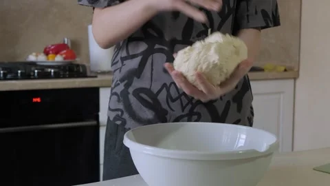 Home baker kneading and shaping dough Stock Footage 338132665