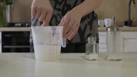 Home baker mixes ingredients Stock Footage 338132639