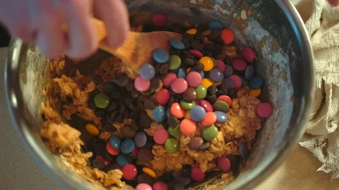 Home baking - smarties cookie dough mixing 動画素材 94038609