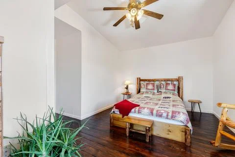 A home bedroom with a bed Stock Photos