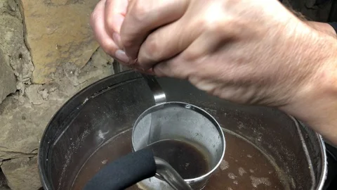 Home beer brewing adding clarifier to wort Stock Footage 127829062