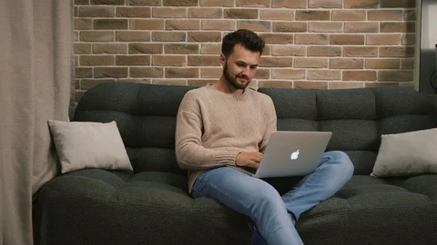 At home behind a laptop1 Stock Footage 129456069