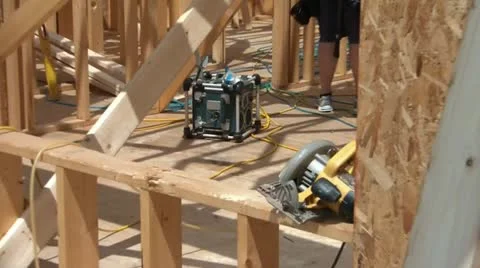 Home Being Constructed - Pan in Sunlight Stock Footage 12600365